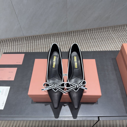 MIUMIU 26S POINTED TOE PUMPS 55MM IN BLACK AND WHITE CALFSKIN WITH BOW