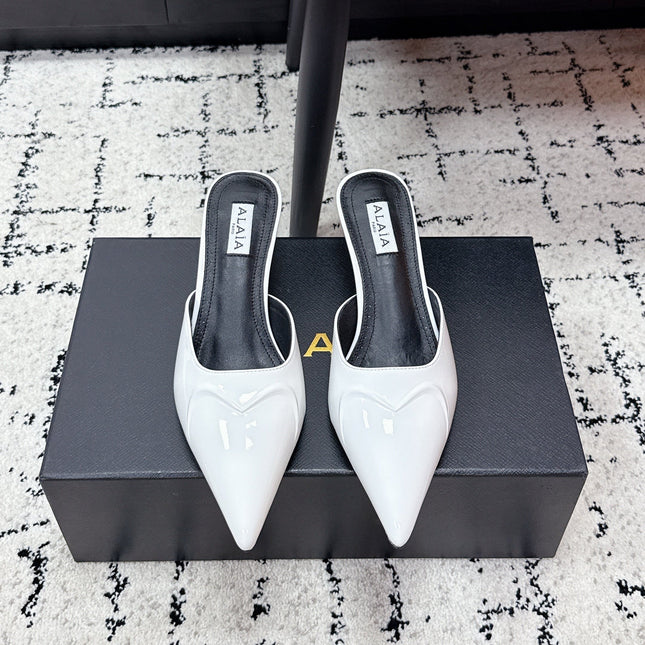ALAIA 26S HEELED MULES 65 MM IN WHITE GLOSSY CALFSKIN