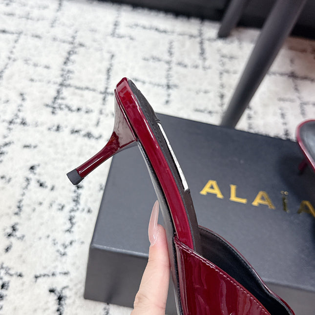 ALAIA 26S HEELED MULES 65 MM IN DARK RED GLOSSY CALFSKIN