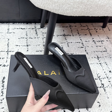 ALAIA 26S HEELED MULES 65 MM IN BLACK SATIN