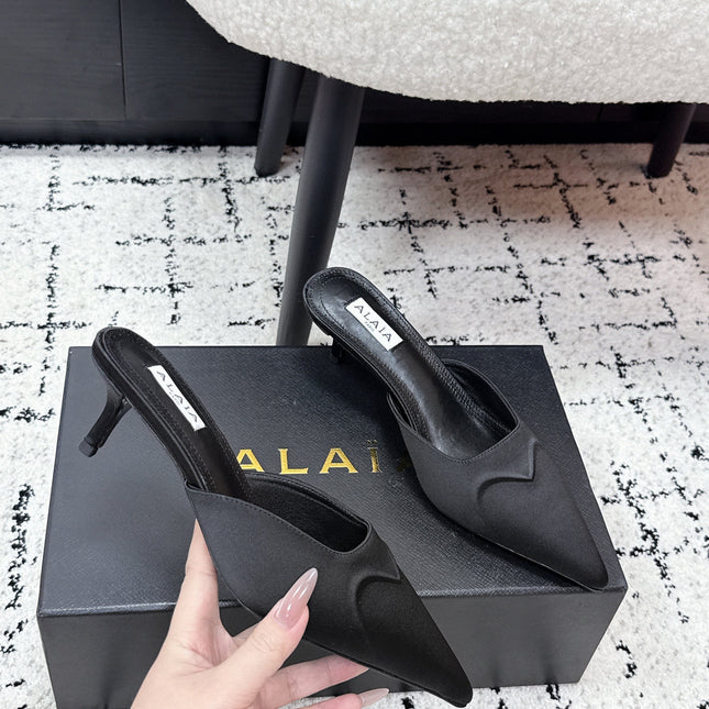 ALAIA 26S HEELED MULES 65 MM IN BLACK SATIN