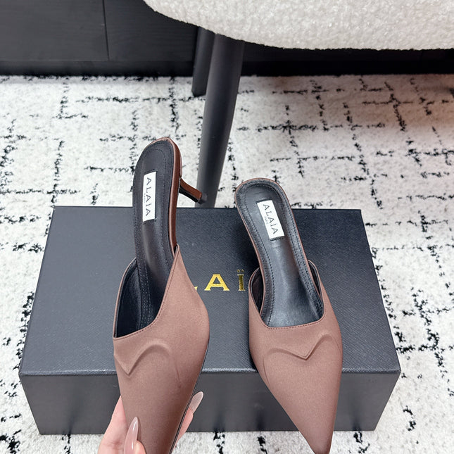 ALAIA 26S HEELED MULES 65 MM IN CHOCOLATE BROWN SATIN