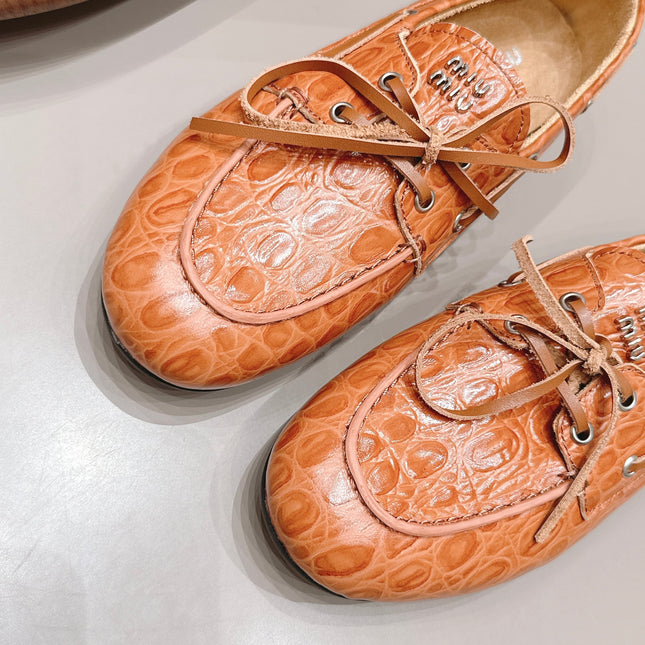 MIUMIU 26S BOAT SHOES IN ORANGE BROWN EMBOSSED CALFSKIN