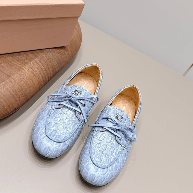 MIUMIU 26S BOAT SHOES IN BLUE EMBOSSED CALFSKIN