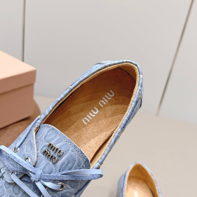 MIUMIU 26S BOAT SHOES IN BLUE EMBOSSED CALFSKIN