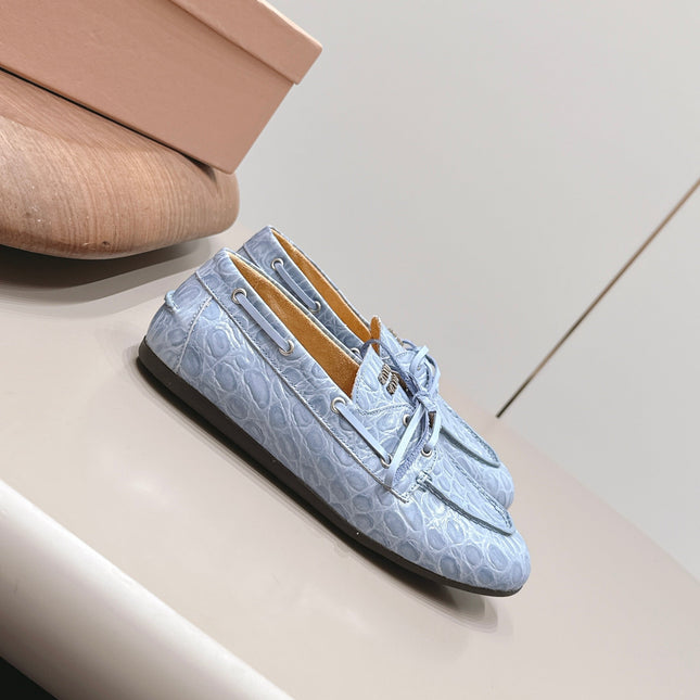 MIUMIU 26S BOAT SHOES IN BLUE EMBOSSED CALFSKIN