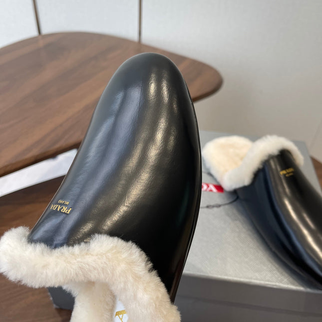 PRADA 25S CLOGS IN BLACK CALFSKIN FUR-LINED