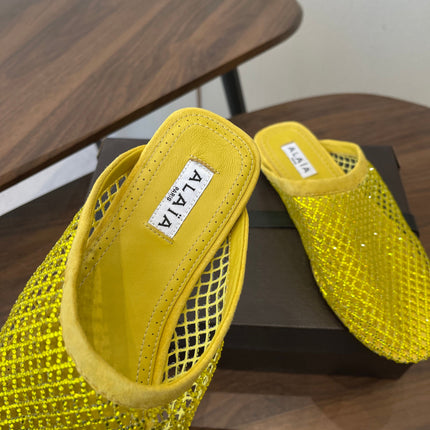 ALAIA 26S FLAT MULES IN DARK YELLOW SUEDE AND MESH RHINESTONE-EMBELLISHED