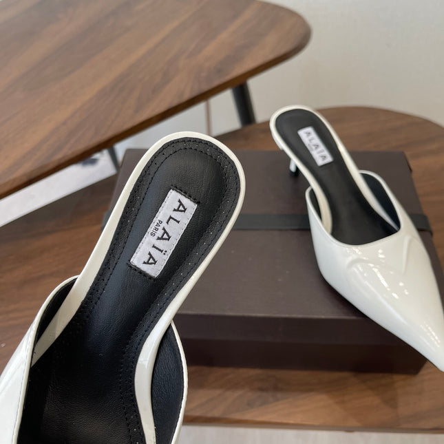 ALAIA 26S HEELED MULES 50 MM IN WHITE GLOSSY CALFSKIN