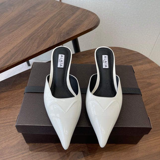 ALAIA 26S HEELED MULES 50 MM IN WHITE GLOSSY CALFSKIN
