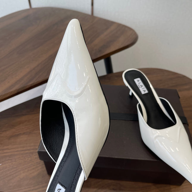 ALAIA 26S HEELED MULES 50 MM IN WHITE GLOSSY CALFSKIN