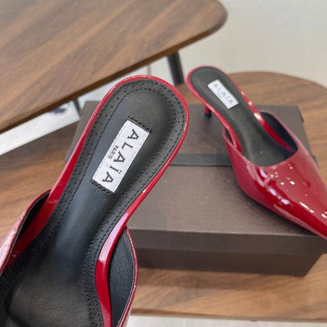 ALAIA 26S HEELED MULES 50 MM IN DARK RED GLOSSY CALFSKIN