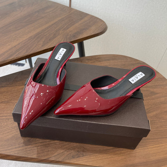 ALAIA 26S HEELED MULES 50 MM IN DARK RED GLOSSY CALFSKIN