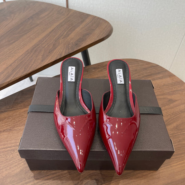 ALAIA 26S HEELED MULES 50 MM IN DARK RED GLOSSY CALFSKIN