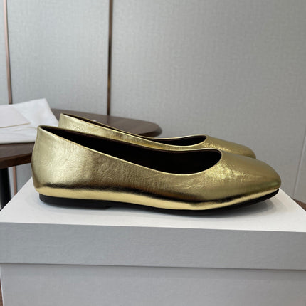 THE ROW 26S FLATS IN GOLD CALFSKIN