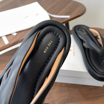 THE ROW 26S PUFFED THONG SANDALS IN BLACK CALFSKIN