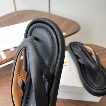 THE ROW 26S PUFFED THONG SANDALS IN BLACK CALFSKIN