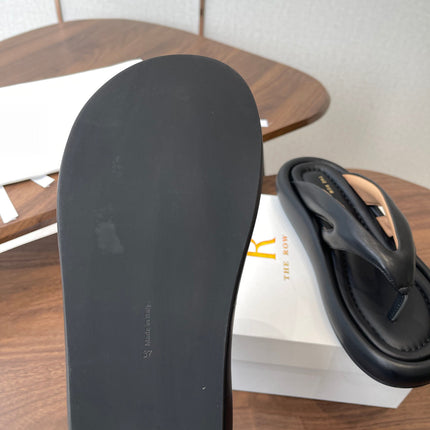 THE ROW 26S PUFFED THONG SANDALS IN BLACK CALFSKIN