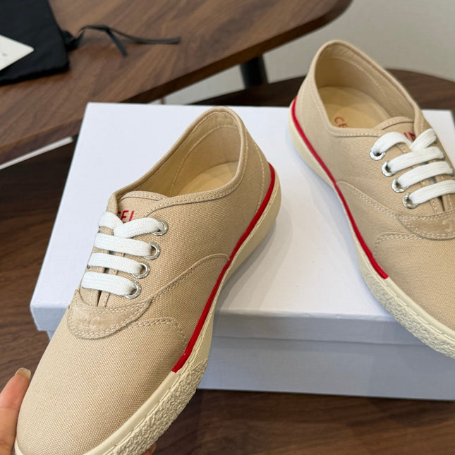 CELINE 26S TRIOMPHE LOW TOP SNEAKERS IN BEIGE CANVAS RED TRIM