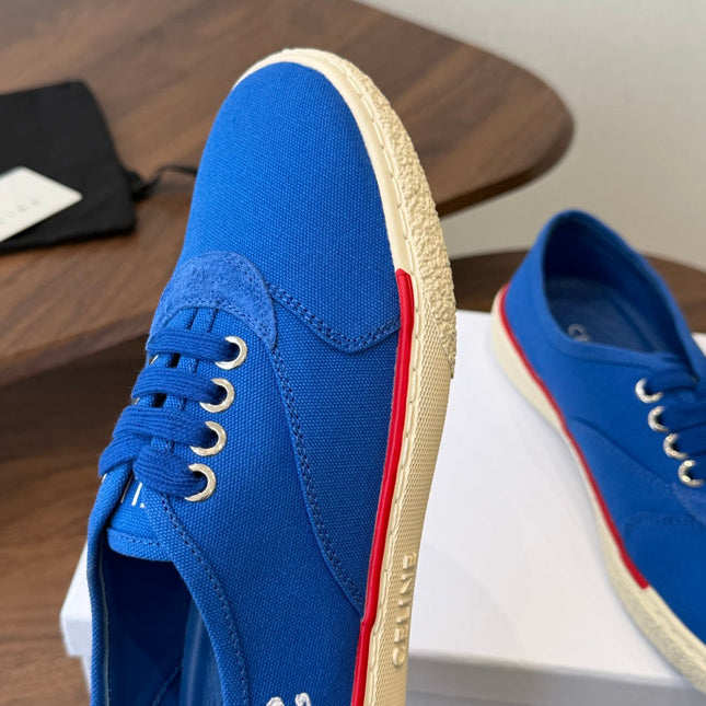 CELINE 26S TRIOMPHE LOW TOP SNEAKERS IN BLUE CANVAS RED TRIM