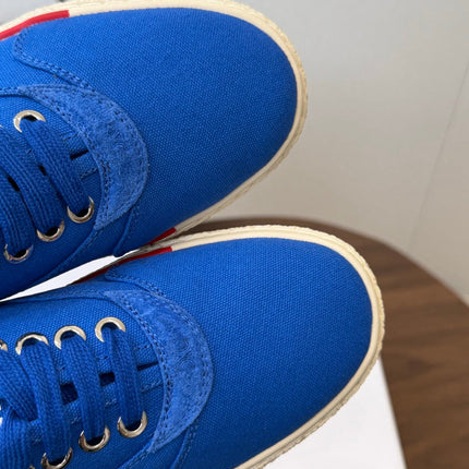 CELINE 26S TRIOMPHE LOW TOP SNEAKERS IN BLUE CANVAS RED TRIM