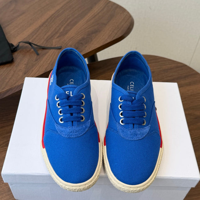 CELINE 26S TRIOMPHE LOW TOP SNEAKERS IN BLUE CANVAS RED TRIM