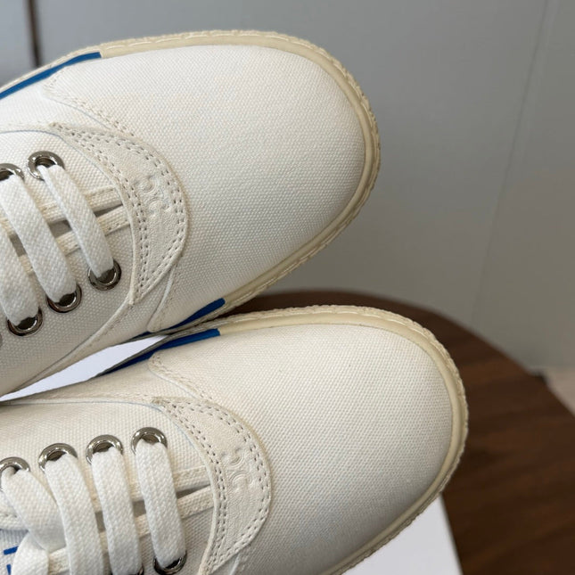 CELINE 26S TRIOMPHE LOW TOP SNEAKERS IN WHITE CANVAS BLUE TRIM