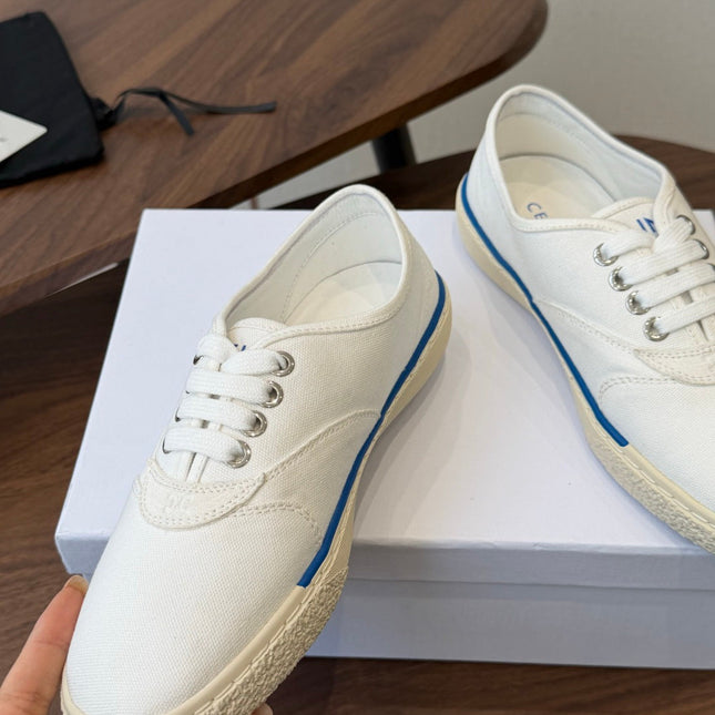 CELINE 26S TRIOMPHE LOW TOP SNEAKERS IN WHITE CANVAS BLUE TRIM