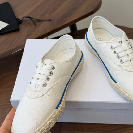 CELINE 26S TRIOMPHE LOW TOP SNEAKERS IN WHITE CANVAS BLUE TRIM