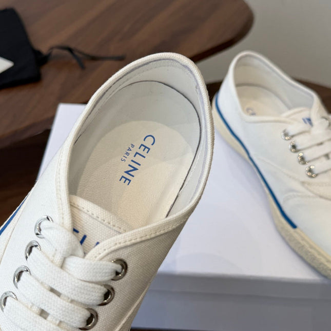 CELINE 26S TRIOMPHE LOW TOP SNEAKERS IN WHITE CANVAS BLUE TRIM