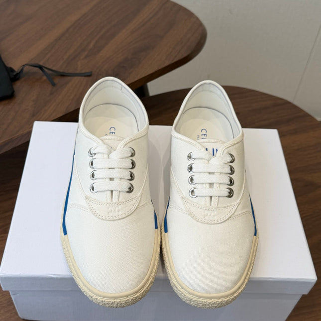 CELINE 26S TRIOMPHE LOW TOP SNEAKERS IN WHITE CANVAS BLUE TRIM