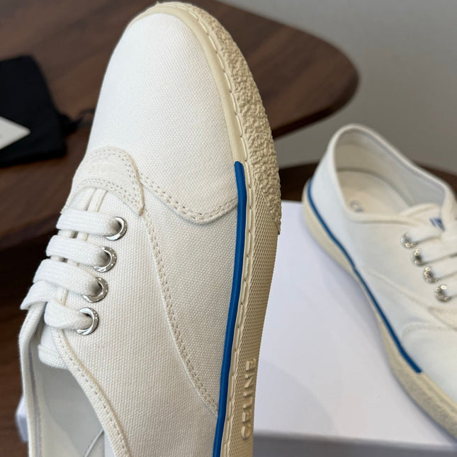 CELINE 26S TRIOMPHE LOW TOP SNEAKERS IN WHITE CANVAS BLUE TRIM