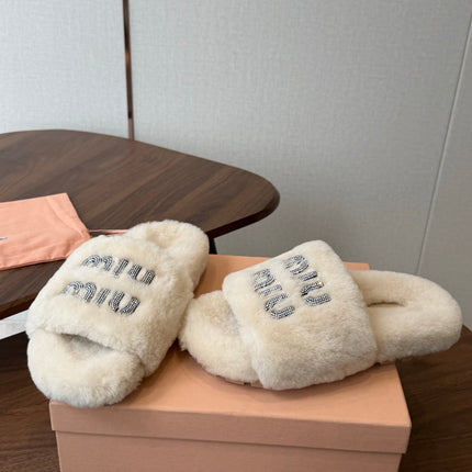 MIUMIU 26S CRYSTAL LOGO SLIDES IN LIGHT BEIGE SHEARLING