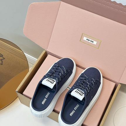 MIUMIU 26S SNEAKER MULES IN NAVY BLUE CANVAS