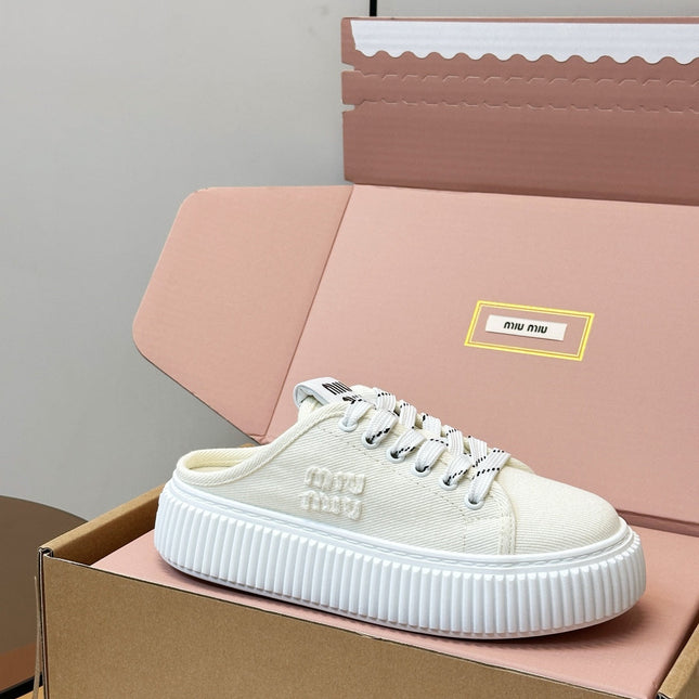 MIUMIU 26S SNEAKER MULES IN LIGHT YELLOW CANVAS
