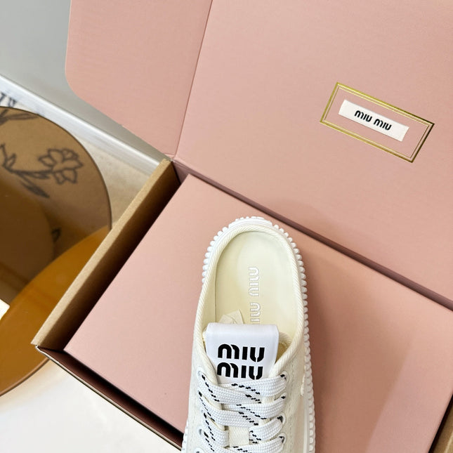 MIUMIU 26S SNEAKER MULES IN LIGHT YELLOW CANVAS