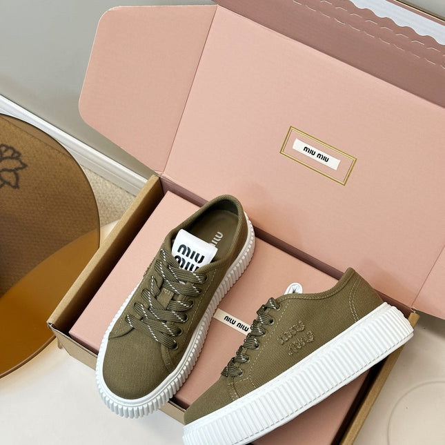 MIUMIU 26S PLATFORM SNEAKERS IN OLIVE GREEN CANVAS