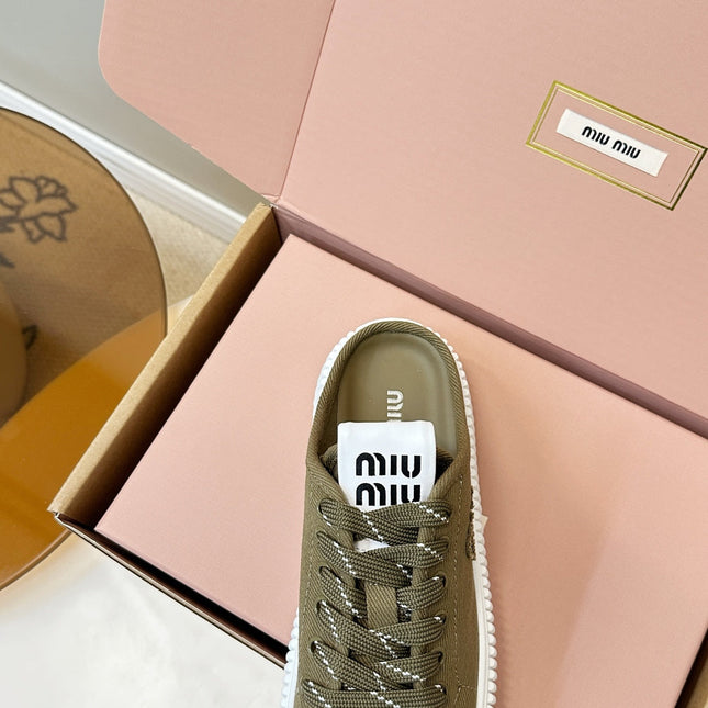 MIUMIU 26S SNEAKER MULES IN OLIVE GREEN CANVAS