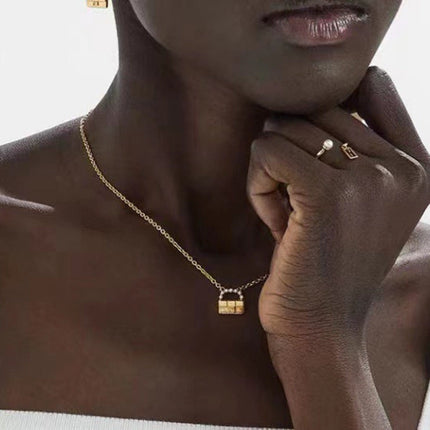 FENDI 26S BAG CHARM PENDANT NECKLACE IN GOLD TONE METAL 625602