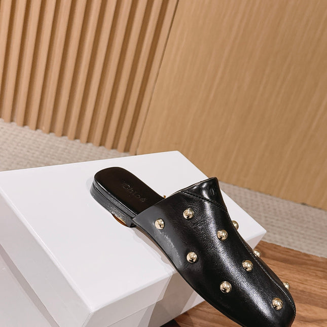CHLOE 26S STUDDED FLAT MULES IN BLACK CALFSKIN