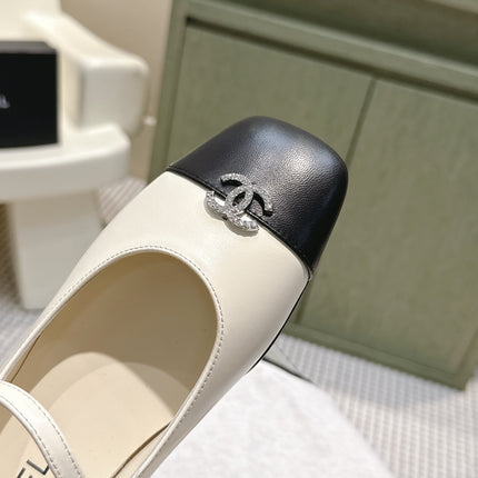 CHANEL 25S MARY JANE FLATS IN IVORY LAMBSKIN WITH BLACK CAP TOE SILVER HARDWARE