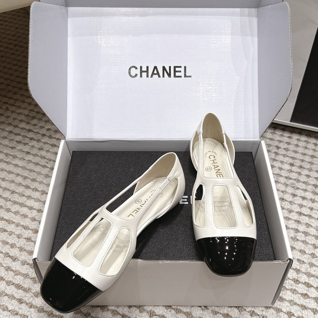 CHANEL 26S ROUND TOE MARY JANE FLATS IN OFF WHITE CUTOUT CALFSKIN WITH BLACK PATENT TOE