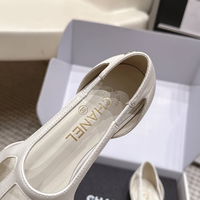 CHANEL 26S ROUND TOE MARY JANE FLATS IN OFF WHITE CUTOUT CALFSKIN WITH BLACK PATENT TOE