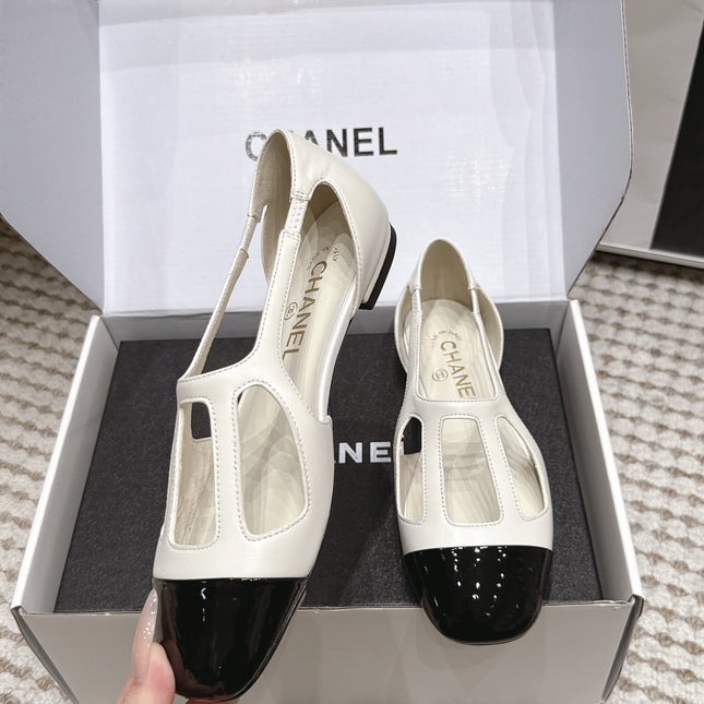 CHANEL 26S ROUND TOE MARY JANE FLATS IN OFF WHITE CUTOUT CALFSKIN WITH BLACK PATENT TOE