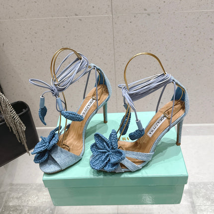AQUAZZURA 26S FLORAL HEELS 100 MM IN PASTEL BLUE WOVEN RAFFIA AND FABRIC