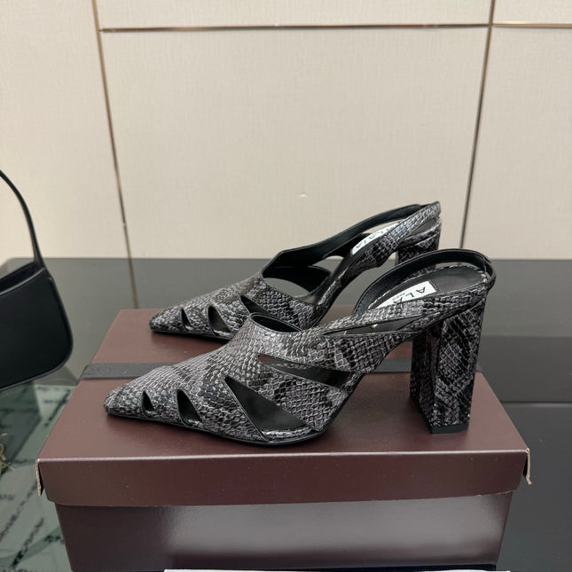 ALAIA 26S HEELED SLINGBACKS IN BLACK PYTHON-EMBOSSED LEATHER