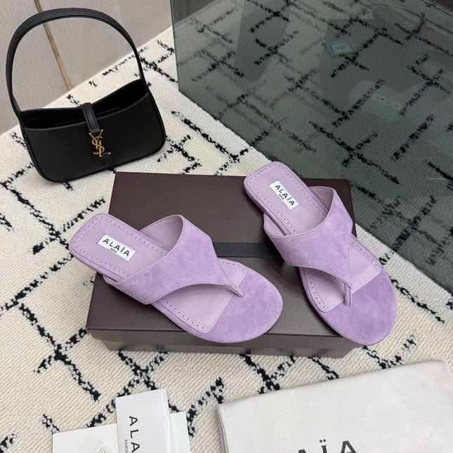 ALAIA 26S THONG MULE SANDALS IN PURPLE SUEDE