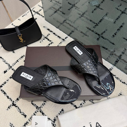 ALAIA 26S THONG MULE SANDALS IN BLACK CALFSKIN