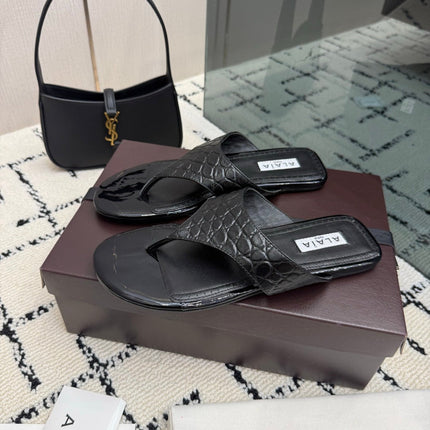 ALAIA 26S THONG MULE SANDALS IN BLACK CALFSKIN