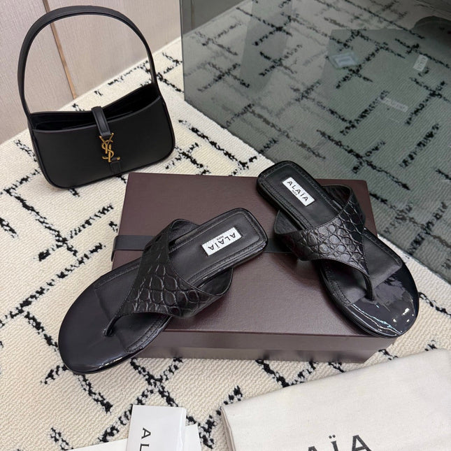 ALAIA 26S THONG MULE SANDALS IN BLACK CALFSKIN